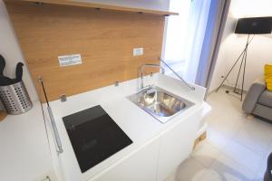 Televízia a/alebo spoločenská miestnosť v ubytovaní Via Siena 4 - Suites & Rooms