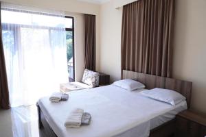 Ένα ή περισσότερα κρεβάτια σε δωμάτιο στο Hotel Estonia Two