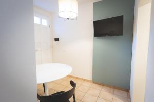 Televízia a/alebo spoločenská miestnosť v ubytovaní Via Siena 4 - Suites & Rooms
