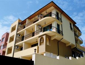 a building with balconies on the side of it at Villa Valeev in Sozopol