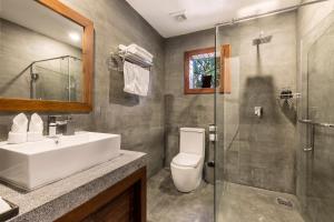 a bathroom with a sink and a toilet and a shower at Won Residence & Spa in Siem Reap