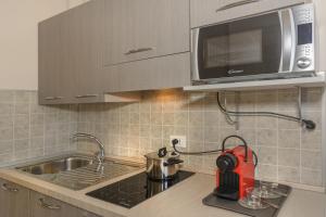 Kuchyň nebo kuchyňský kout v ubytování Hotel Sogno