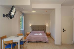 Postel nebo postele na pokoji v ubytování Hotel Sogno