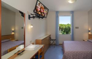 TV a/nebo společenská místnost v ubytování Hotel Sogno
