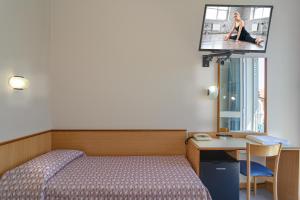 Postel nebo postele na pokoji v ubytování Hotel Sogno