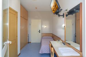 Postel nebo postele na pokoji v ubytování Hotel Sogno