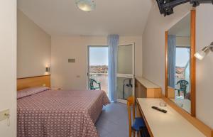 Postel nebo postele na pokoji v ubytování Hotel Sogno