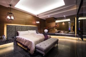 Postel nebo postele na pokoji v ubytování U-Her Hotel