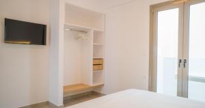 Ένα ή περισσότερα κρεβάτια σε δωμάτιο στο Anfi Suites
