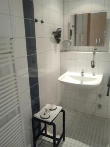 Ein Badezimmer in der Unterkunft Gästehaus Germania