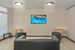 TV a/nebo společenská místnost v ubytování Hotel Sogno