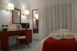 Postel nebo postele na pokoji v ubytování Tafuri Hotel