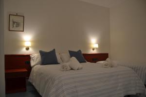 Postel nebo postele na pokoji v ubytování Tafuri Hotel
