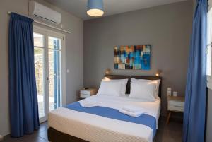 Posteľ alebo postele v izbe v ubytovaní Οasis Apartments
