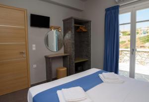 Posteľ alebo postele v izbe v ubytovaní Οasis Apartments