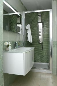 a bathroom with a white sink and a shower at Casa Nanà Amalfi Coast in Vietri