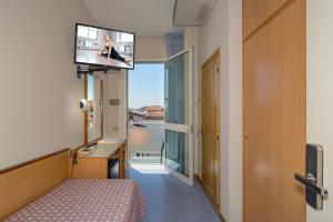 TV a/nebo společenská místnost v ubytování Hotel Sogno