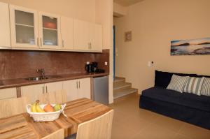Kuchyň nebo kuchyňský kout v ubytování Οasis Apartments