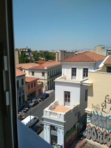 a view from a window of a city street with buildings at Pella Inn Hostel in Athens