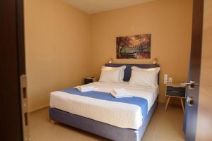 Posteľ alebo postele v izbe v ubytovaní Οasis Apartments