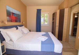 Posteľ alebo postele v izbe v ubytovaní Οasis Apartments