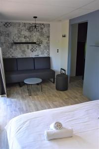 Postel nebo postele na pokoji v ubytování Lodges du Sancy