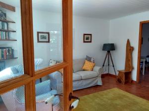 a living room with a couch and a glass door at Number15 Guesthouse Carcassonne in Carcassonne