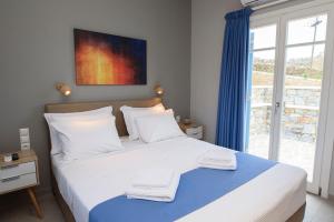 Posteľ alebo postele v izbe v ubytovaní Οasis Apartments