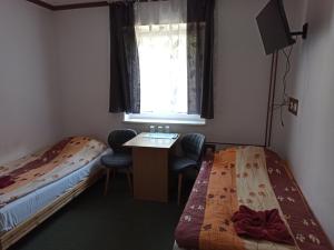 Postel nebo postele na pokoji v ubytování Gościniec Silver