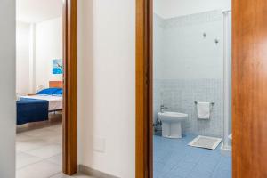 a bathroom with a toilet and a shower at Residence Catona in Otranto +174 photos