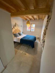 a bedroom with a king sized bed in a attic at The Little Caravia in Caravia