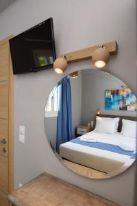 Posteľ alebo postele v izbe v ubytovaní Οasis Apartments