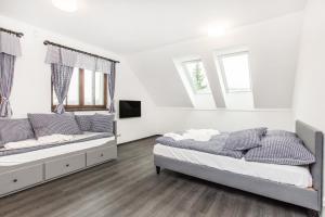 Postel nebo postele na pokoji v ubytování Apartmany Na Salasi