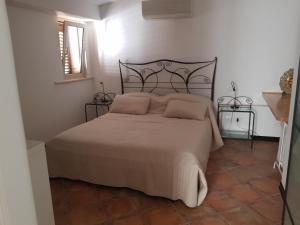 Posteľ alebo postele v izbe v ubytovaní Giasone Apartments