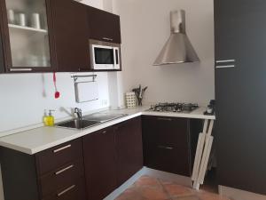 Kuchyňa alebo kuchynka v ubytovaní Giasone Apartments
