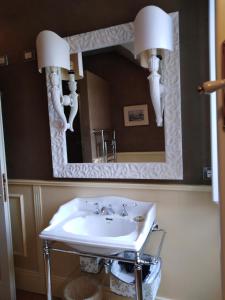 a bathroom with a sink and a mirror at La Cabana Cinque Terre Monterosso in Monterosso al Mare +37 photos
