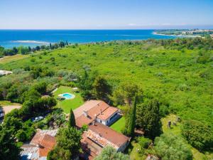 an aerial view of a house on a hill next to the ocean at Villa Moira by Interhome in Umag