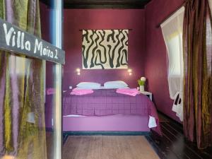 Łóżko lub łóżka w pokoju w obiekcie Villa Moira by Interhome