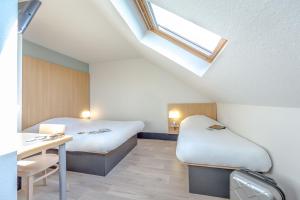 Postel nebo postele na pokoji v ubytování B&B HOTEL PERPIGNAN Nord Aéroport
