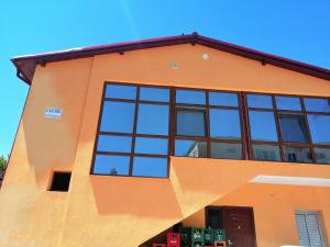 a building with windows on the side of it at CASA GABI'S in Orşova