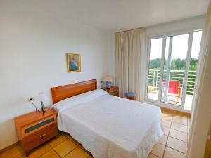 Säng eller sängar i ett rum på Apartment Panoramica by Interhome