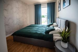 Posteľ alebo postele v izbe v ubytovaní Marina Lake Iława