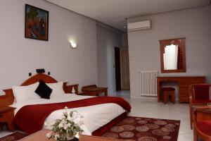 Кровать или кровати в номере Hotel Bouregreg