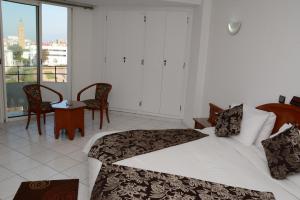 Кровать или кровати в номере Hotel Bouregreg