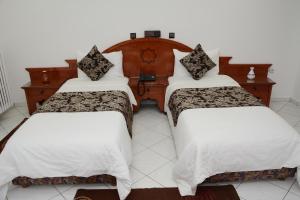 Кровать или кровати в номере Hotel Bouregreg