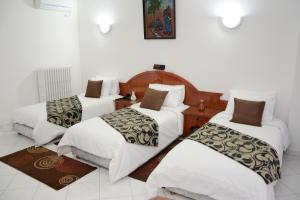 Кровать или кровати в номере Hotel Bouregreg