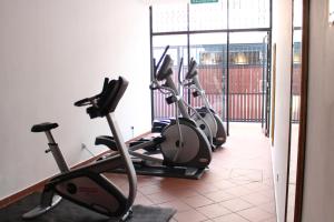 a row of exercise bikes in a gym at Heeren Straits Hotel in Malacca