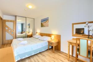 Posteľ alebo postele v izbe v ubytovaní Apartment Olymp