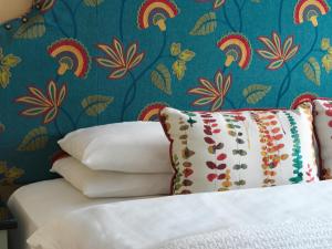 a bed with a white comforter and pillows at Hayes Hotel in Thurles