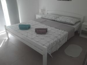 Posteľ alebo postele v izbe v ubytovaní Apartman Bunarić